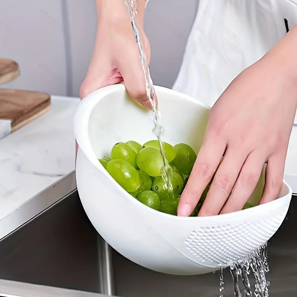 Rice Rinsing Strainer Bowl — Green grapes being rinsed in the white bowl over a sink