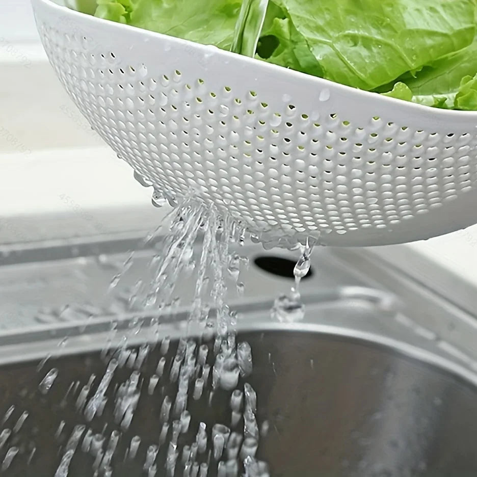 Rice Rinsing Strainer Bowl — Close-up of lettuce rinsing and water flowing through side perforations