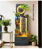 Rockery Water Fountain in a supplier balcony scene beside potted plants and a glass-topped side table.