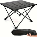 Roll-Up Camping Table black slatted tabletop and X-shaped legs, with a carry bag held below.