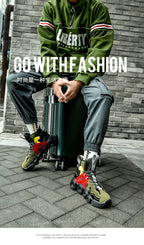 Roller-Inspired Street Sneakers in army green worn with gray cargo joggers and a green top beside a suitcase