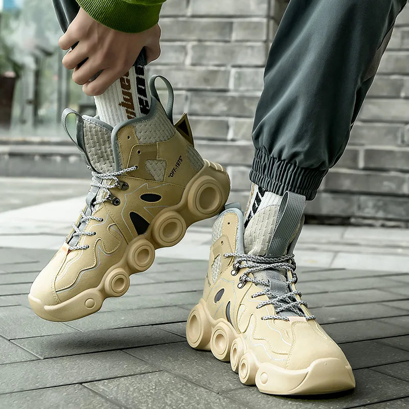 Beige Roller-Inspired Street Sneakers worn with gray joggers, showing the front and outer side of the pair