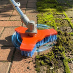 Rotary Surface Cleaning Brush attached to a powered shaft while scrubbing moss from brick pavers