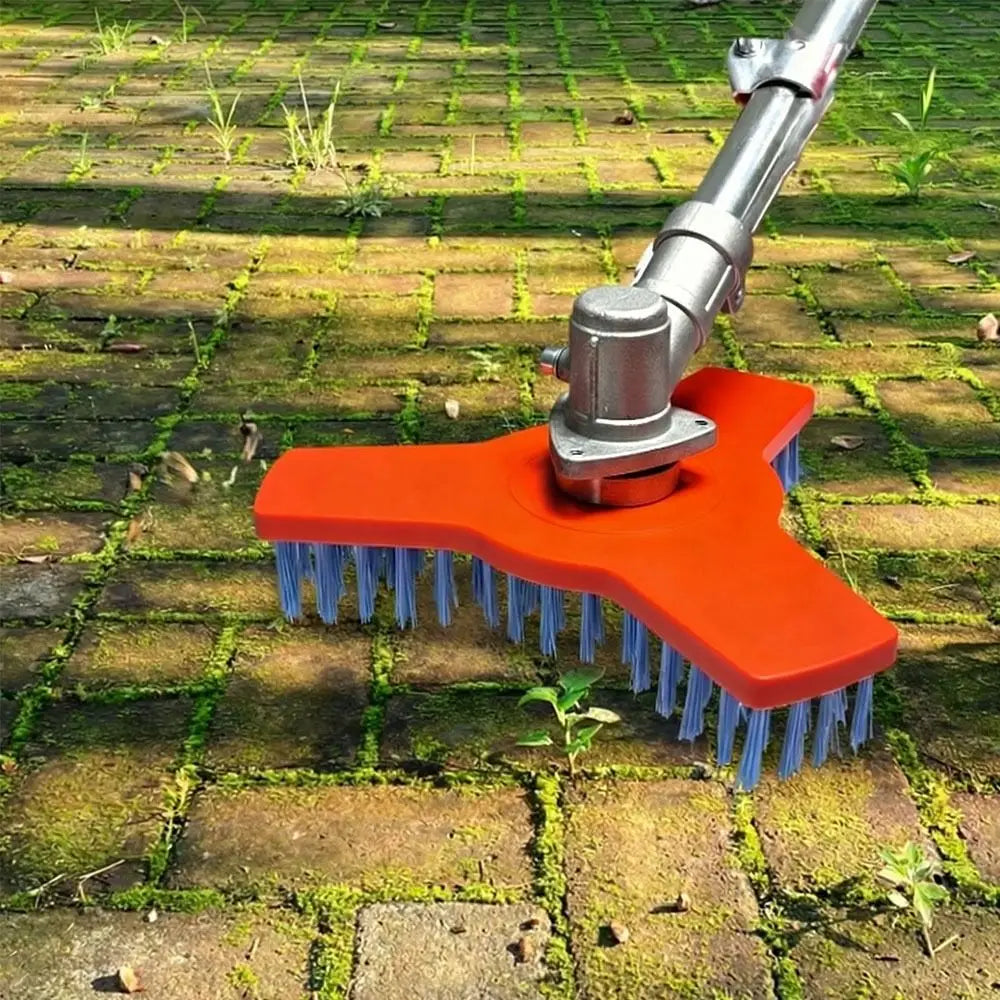 Rotary Surface Cleaning Brush attached to a powered tool and scrubbing a mossy block-paved path