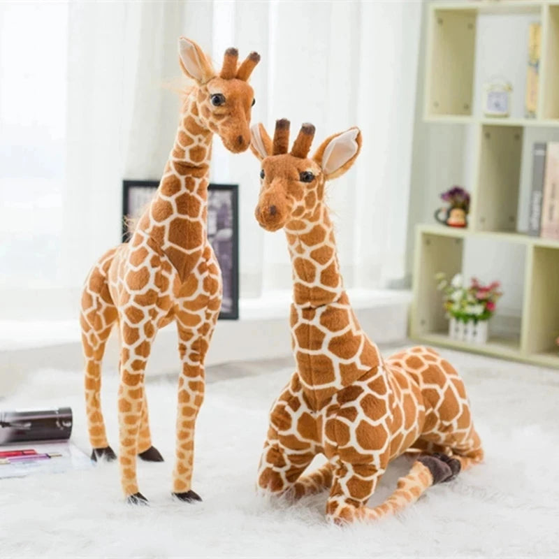 Safari Giraffe Stuffed Animal standing and resting poses on a white rug.