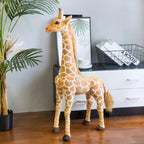 Safari Giraffe Stuffed Animal standing beside a potted palm and white cabinet.