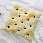 Saltine Cracker Pillow Cover styled diagonally on a light textured bed