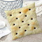 Saltine Cracker Pillow Cover styled with neutral bedding, a side table, and a cup