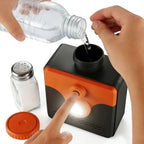 Saltwater Emergency Light being filled with water beside salt, with a finger pressing the front switch