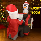 Santa Penguin Piano Inflatable rear view beside a Christmas tree, with a 4.92FT and 150cm size label.