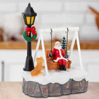 Three-quarter view of Santa Swing Christmas Scene showing swing, dog, tree and lamppost in a home setting