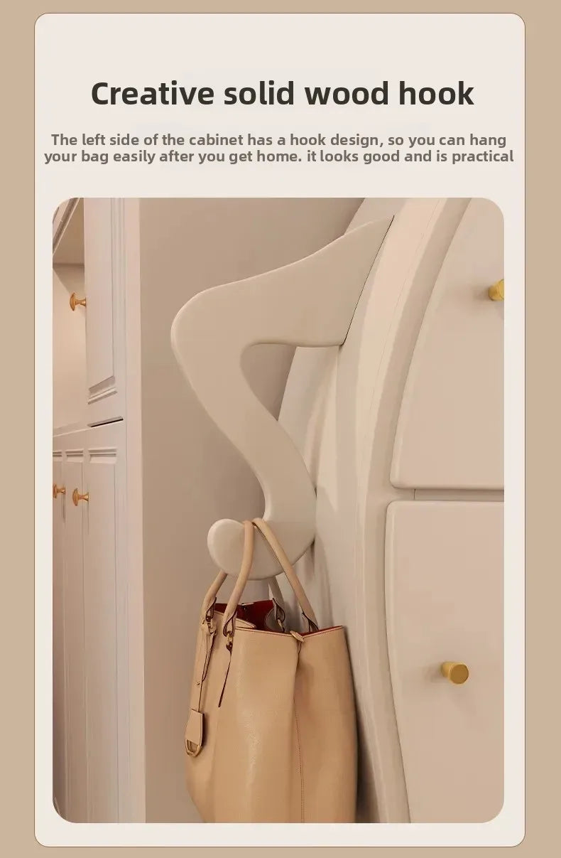 Sassy Pants Drawer Cabinet: Close-up of the bent white arm hook holding a beige handbag.