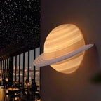Saturn Hemisphere Wall Lamp glowing with warm light on a dark feature wall