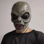 Scary Alien Monster Mask worn with a black T-shirt, showing glossy black eyes and a toothy red-accented mouth.