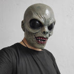 Scary Alien Monster Mask in a three-quarter view, showing its sculpted ear and wrinkled gray-green face.