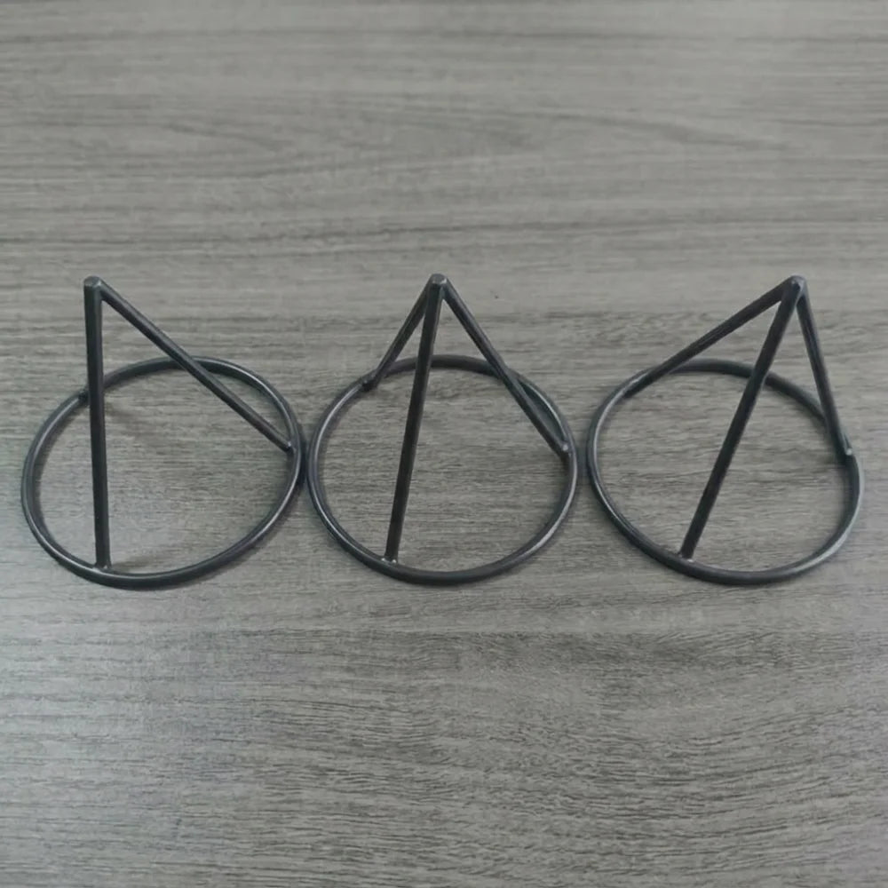 Seed Germination Racks in the black color option shown as three tapered plastic supports