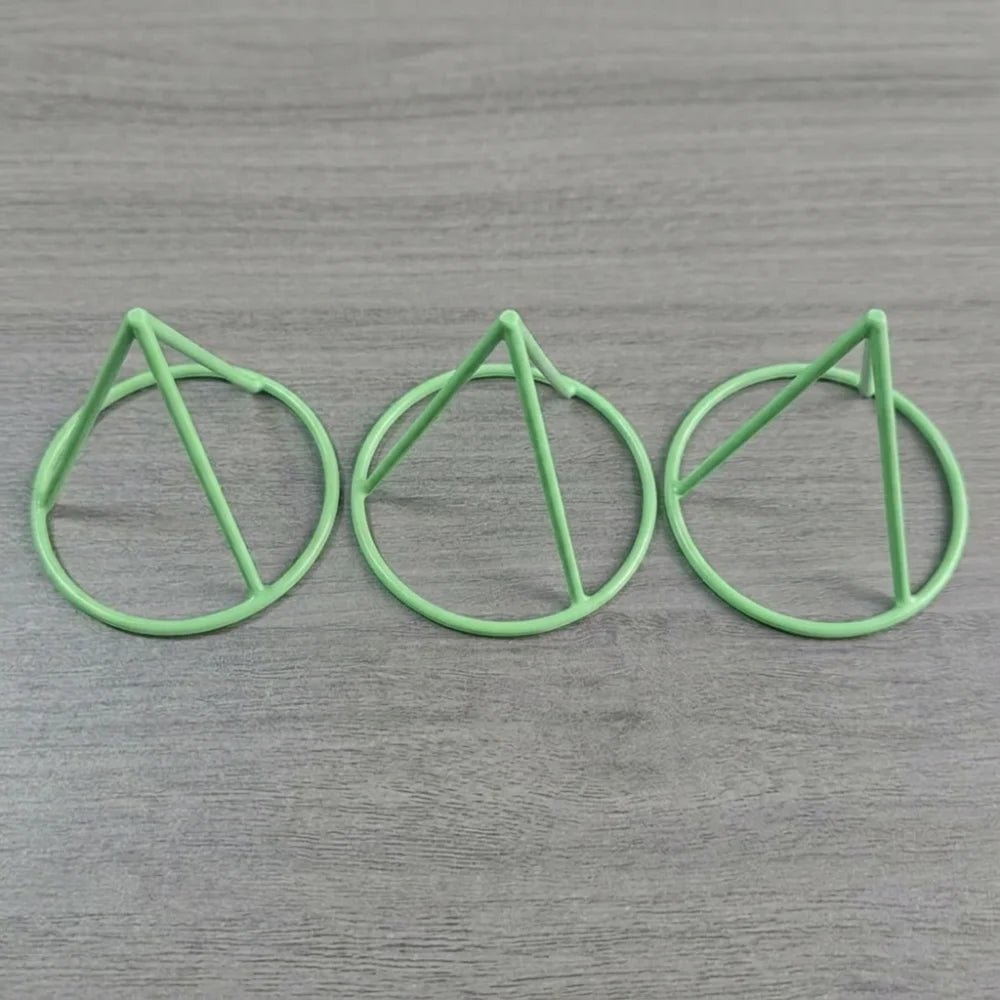 Seed Germination Racks in the green color option shown as three tapered plastic supports