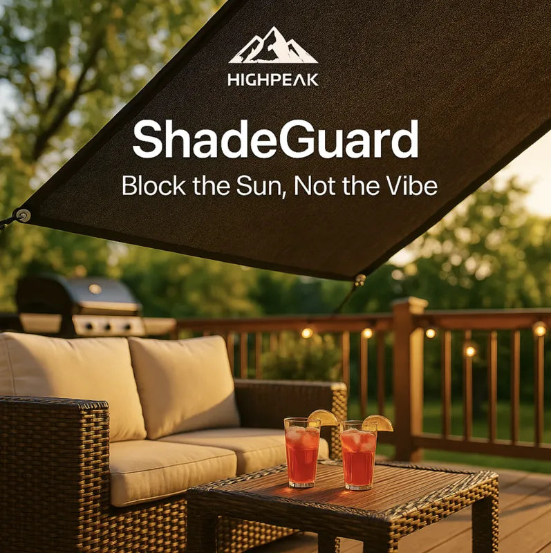 HighPeak ShadeGuard in dark fabric shading a cozy outdoor deck with wicker furniture and drinks on a sunny evening