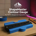 HighPeak ShapeMaster™ Contour Gauge in blue with black frame on wood table for precise edge and curve copying.