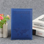 Signature Leather Passport Cover in Deep Blue, shown upright with stitched edges and a tonal world-map design.