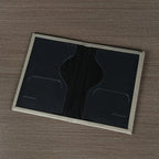 Signature Leather Passport Cover in Gray opened flat to show the dark interior document and card pockets.