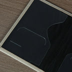 Signature Leather Passport Cover close-up of dark interior card slots and a curved document-pocket opening.