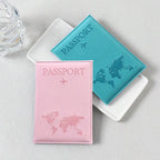 Signature Leather Passport Cover in Light Pink and turquoise Blue, arranged beside a white tray.