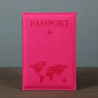 Signature Leather Passport Cover in Rose Red standing on a wooden tabletop with its hot pink front visible.
