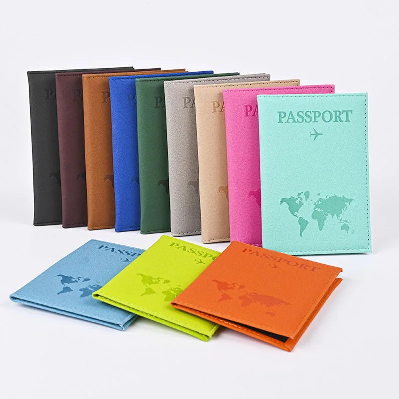 Signature Leather Passport Cover supplier display showing upright and stacked passport covers in assorted colors.