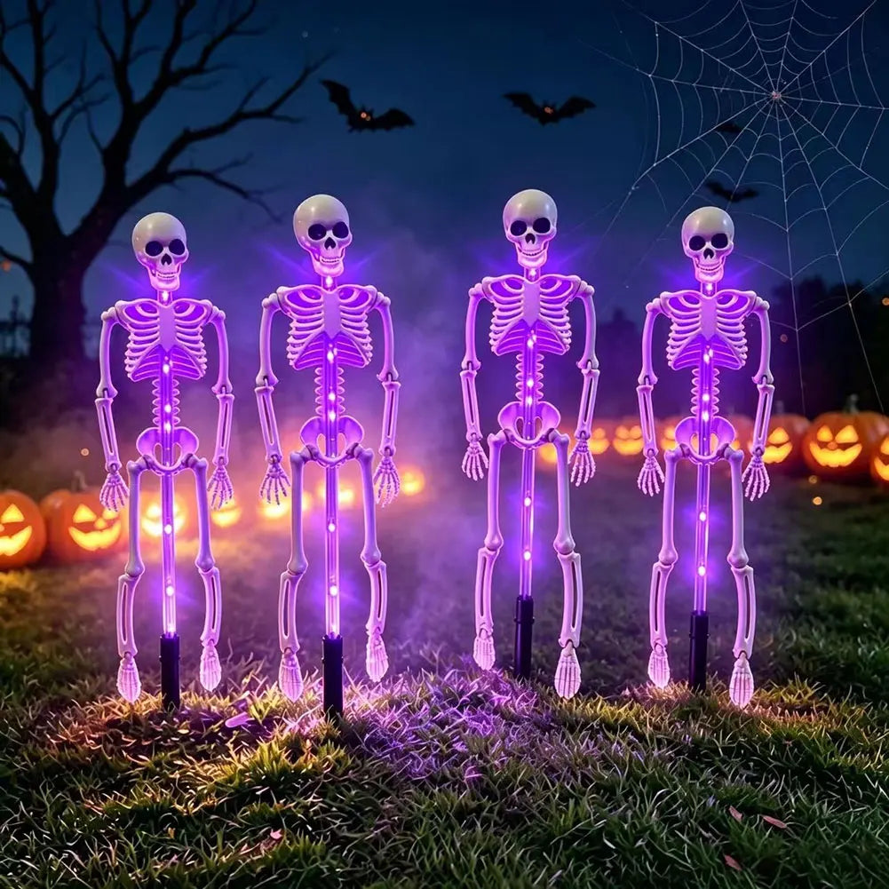 Cropped top edge of a Halloween night scene with a bat, bare branches and spiderweb