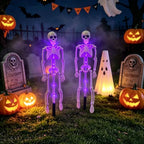 Two purple skeleton stake lights surrounded by pumpkins, tombstones and a glowing ghost