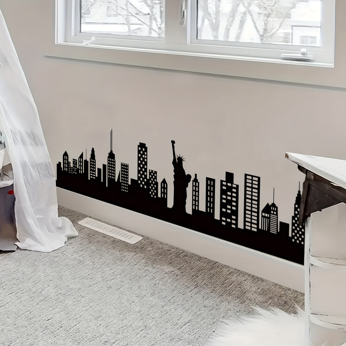 Skyline Wall Decal installed along a bedroom baseboard beneath a window in a bright neutral room