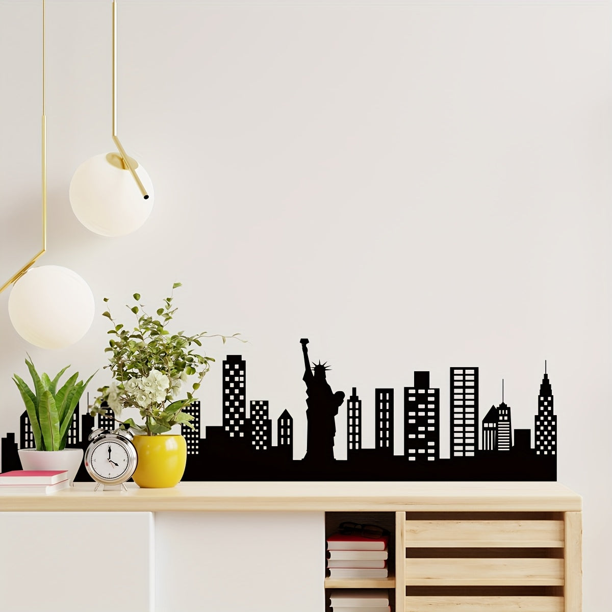 Skyline Wall Decal displayed above a wood console with plants, a clock and modern pendant lights