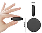 Smart Android Bluetooth Tracker — Black tracker held between fingers with diameter and thickness measurements