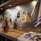 Soccer Goal Bottle Opener mounted on a home bar wall beside bottles and glasses