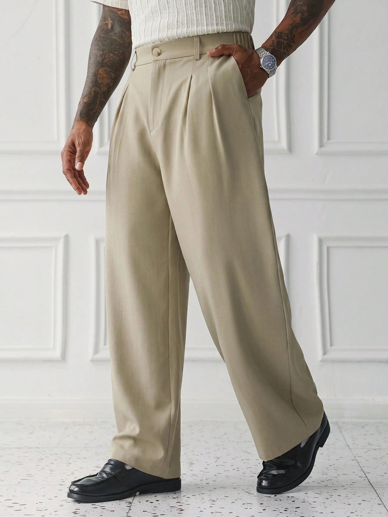 Sorrento Wide Leg Trousers worn in a three-quarter pose with front pleats, side pockets and wide legs