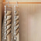 Space Saving Pants Hanger shown from the side, with two loaded racks taking up a narrow section of closet rail.