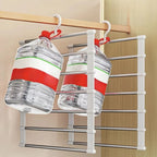 Space Saving Pants Hanger in a supplier demonstration showing water jugs suspended from two hanger hooks.