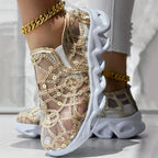 Sparkle Lace Women's Shoes gold shoe raised to show its decorative lace and sculpted white sole