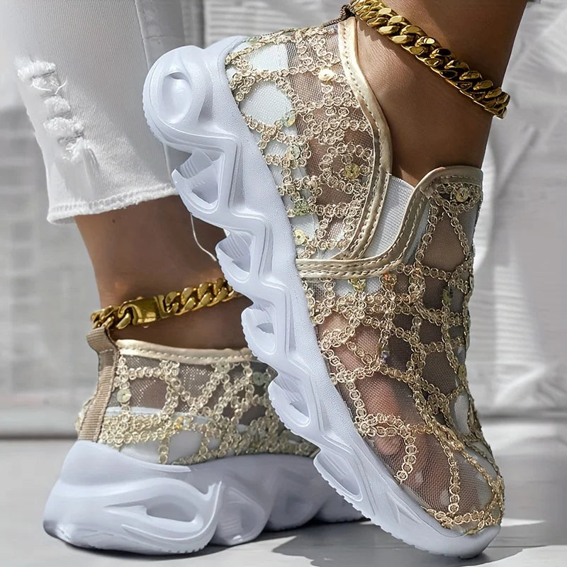 Sparkle Lace Women's Shoes in gold, shown on feet with a sheer patterned upper and chunky white sole