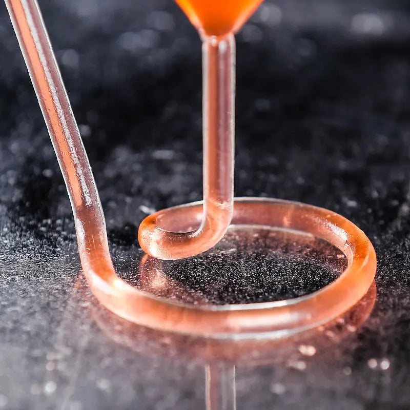 Spiral Straw Cocktail Glass close-up showing the hollow looped base and connected stem