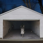 Spooky Girl Garage Banner on a white garage beneath dark blue sky and bare tree silhouettes