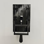 Spooky Light Switch Cover in black, showing the 1-Switch model with its lever lowered on a light wall