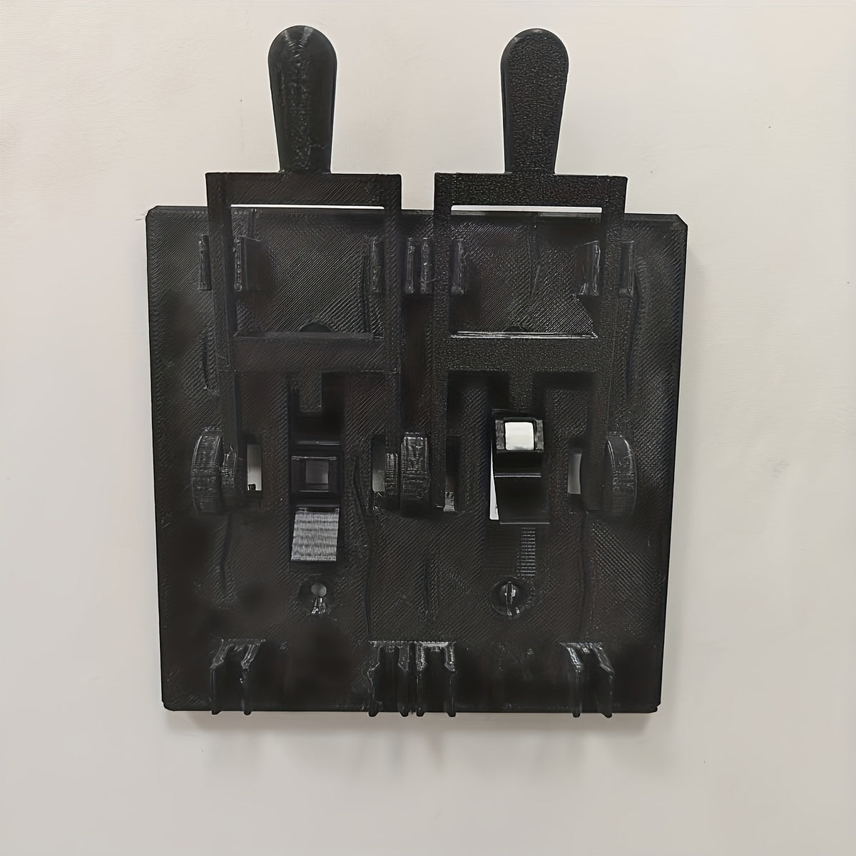 Spooky Light Switch Cover in black, showing the 2-Switch model with two raised lever handles