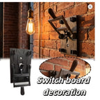 Spooky Light Switch Cover retro display with a raised lever on a brick wall beside a hanging bulb