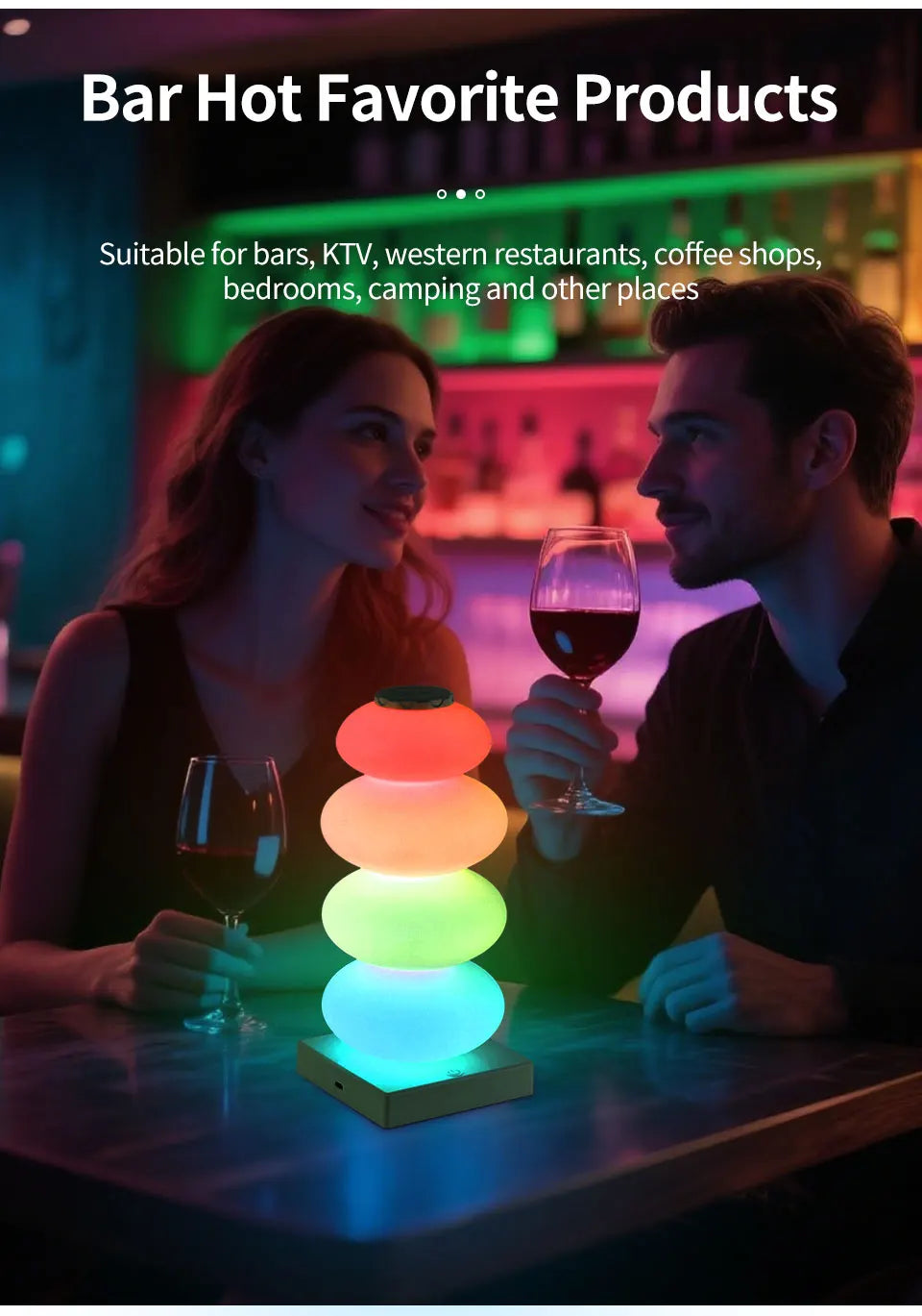 Stacked Pebble RGB Lamp illuminating a bar table in a tall lifestyle image with two adults.