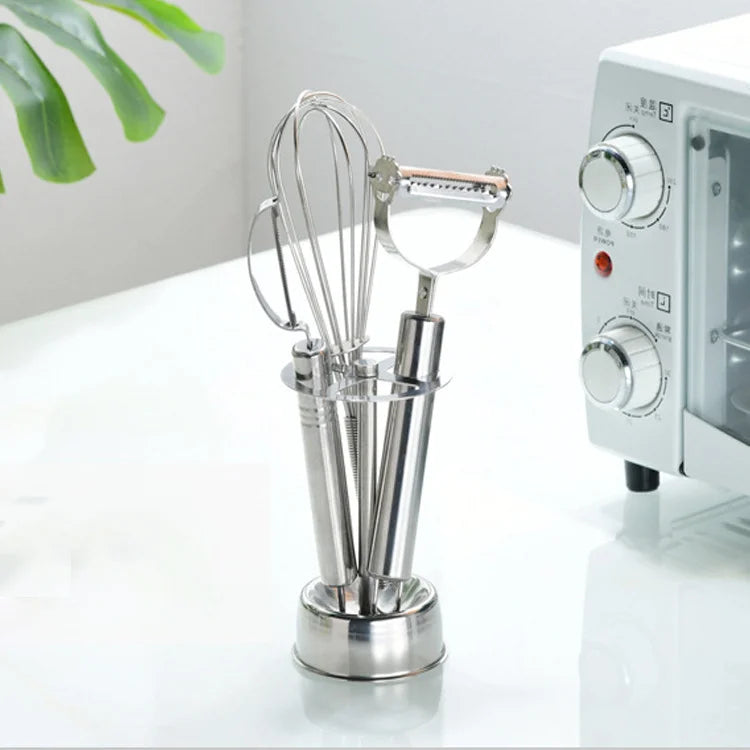 Stainless Toothbrush Holder used as a freestanding organizer for a whisk and vegetable peeler