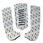 Underside of three surfboard traction pad sections showing peel-off adhesive backing and center slots