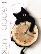 Swinging Cat Wall Clock black cat variant shown front-facing in a decorative GOOD LUCK product graphic
