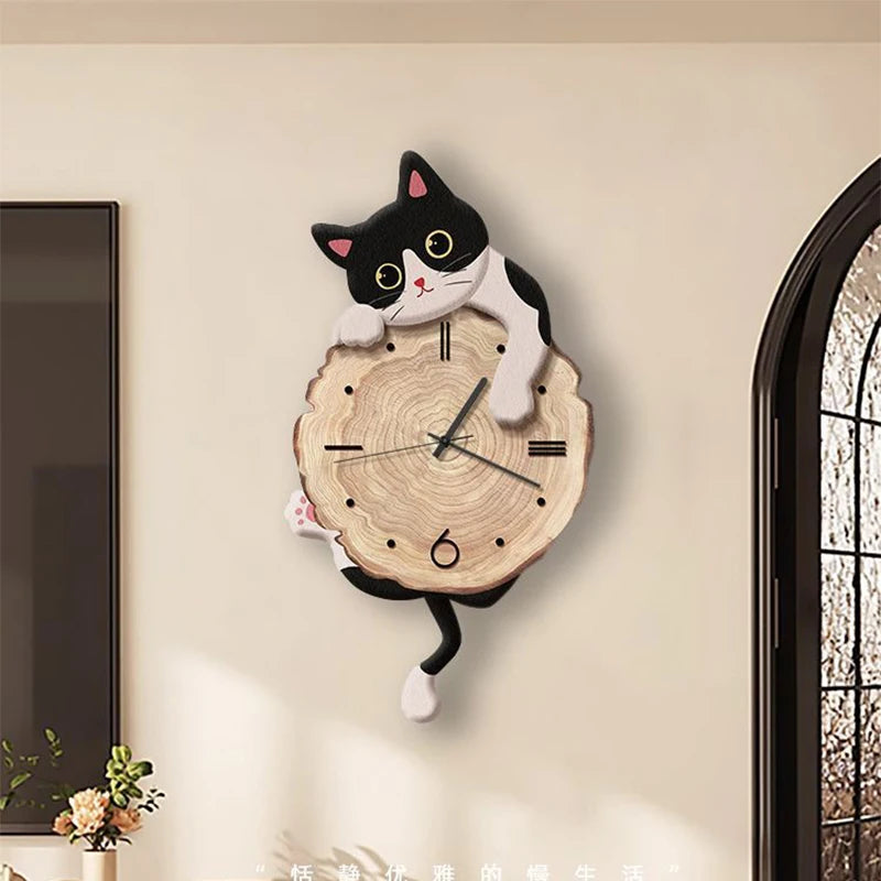 Swinging Cat Wall Clock milk cat variant mounted on a bright wall with its black and white tail below